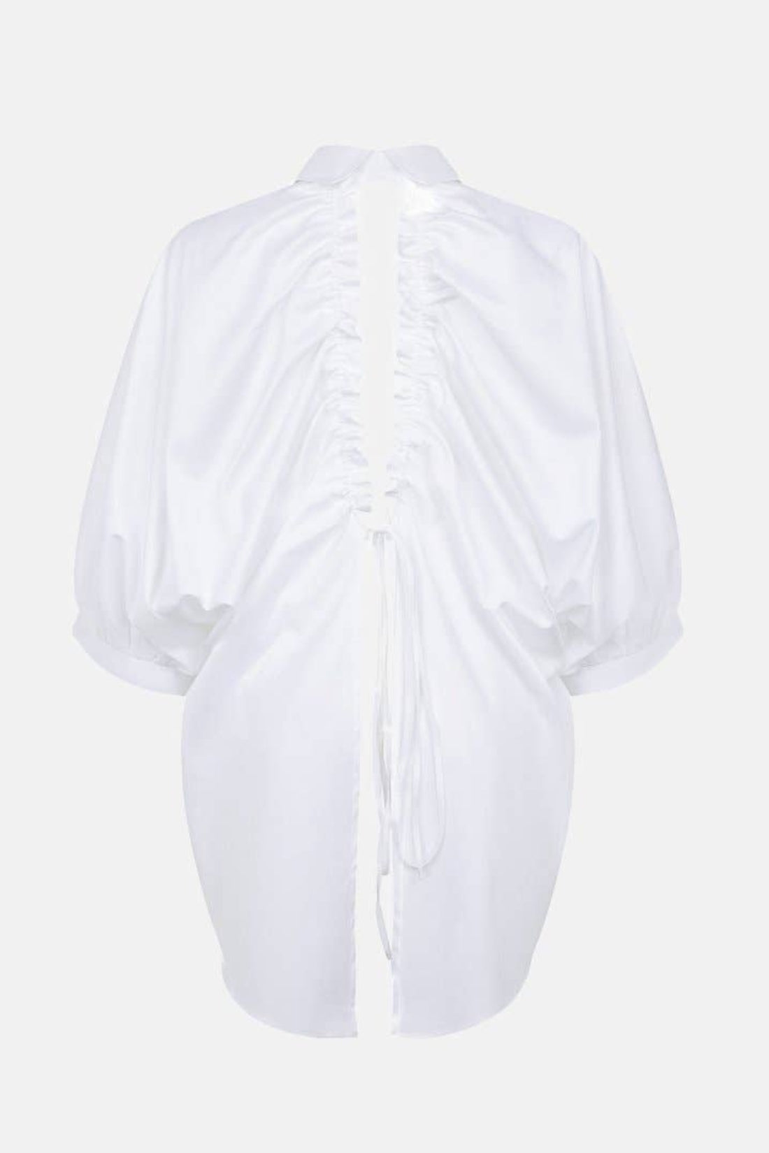 White blouse with ruched sleeves on a light gray background