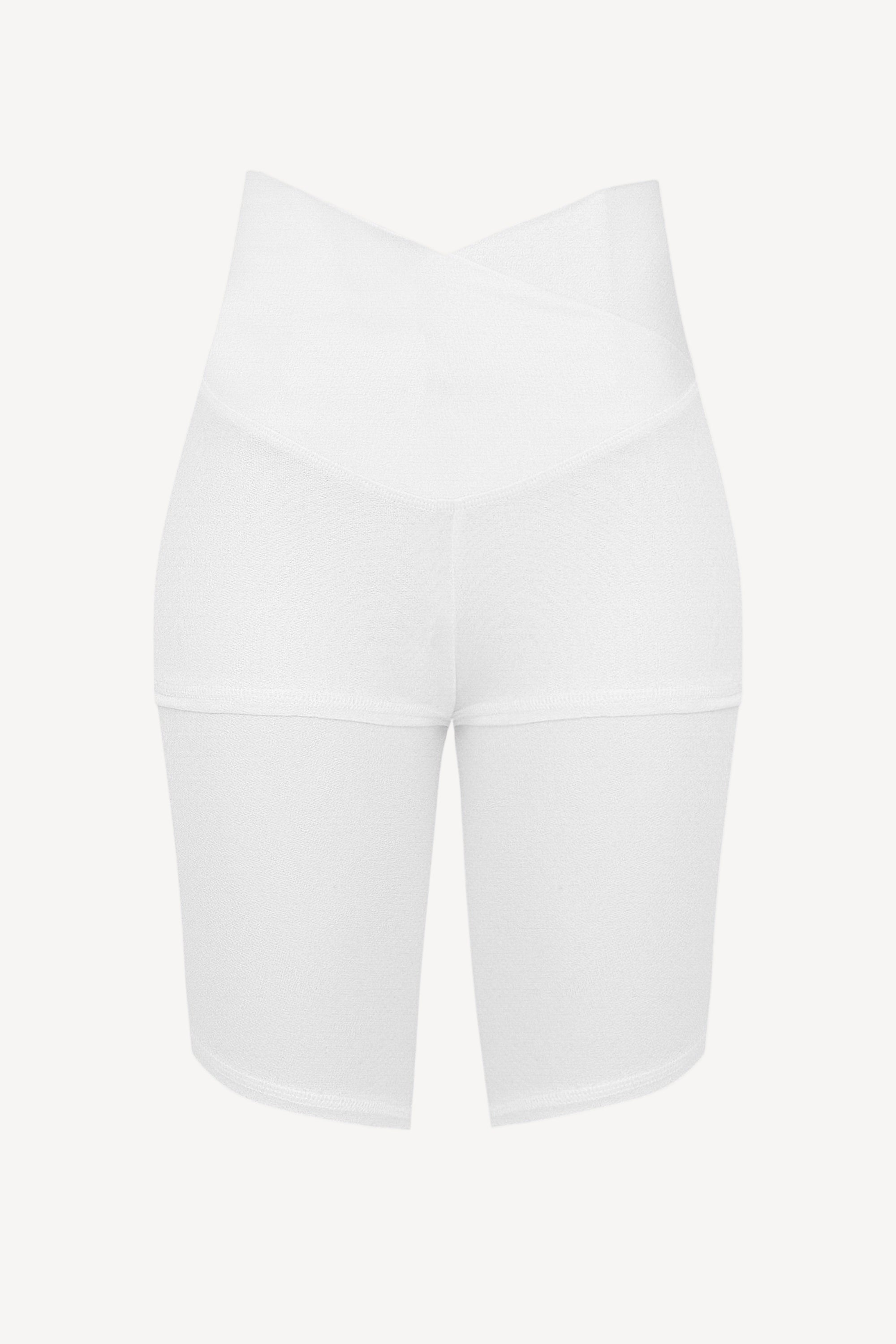 White athletic shorts on a light beige background