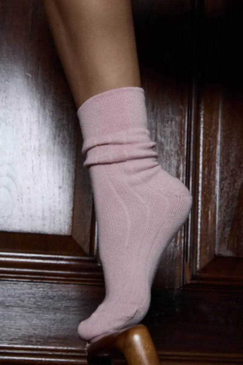 Pink sock on a wooden floor