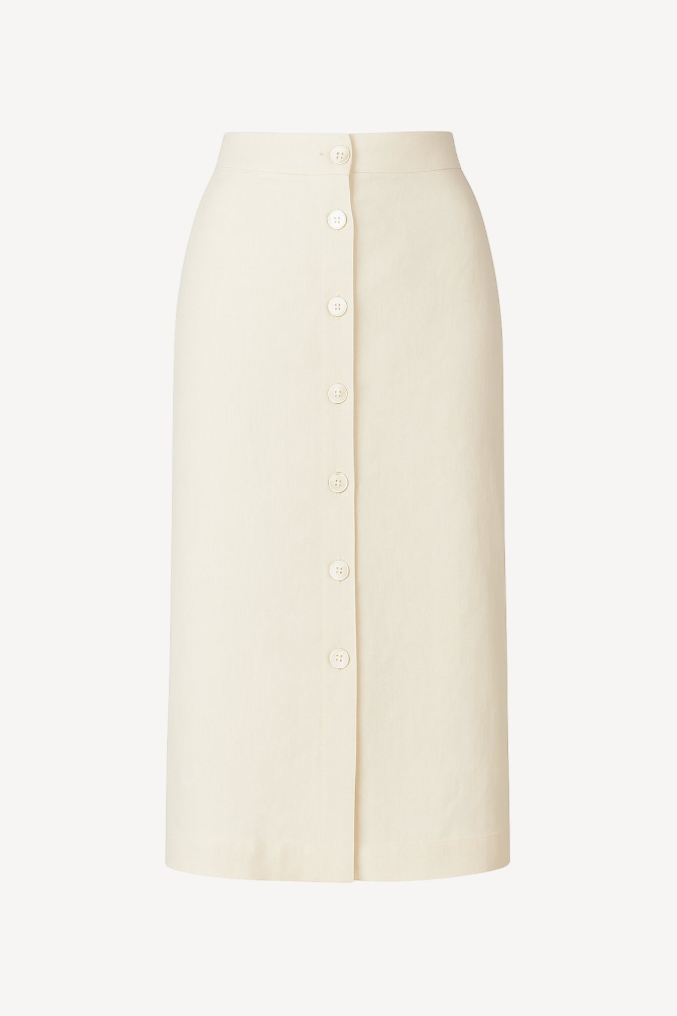 Midi length linen skirt against white backdrop.