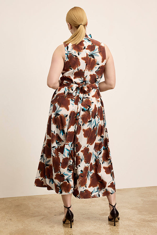 Woman wearing a floral dress with a neutral background | Exclude