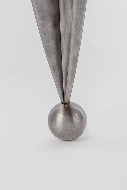 Metallic pen cap on a light gray background