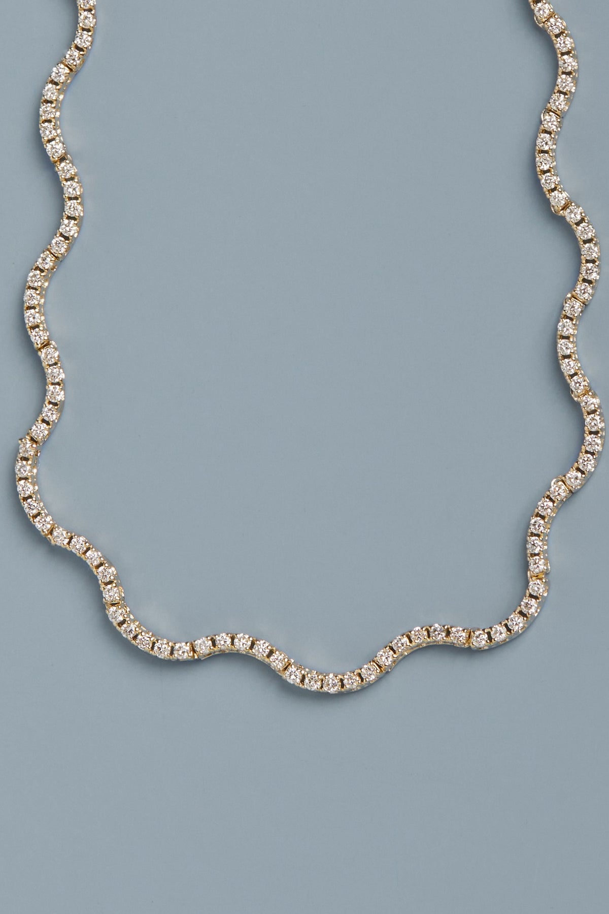 Diamond necklace on a light blue background