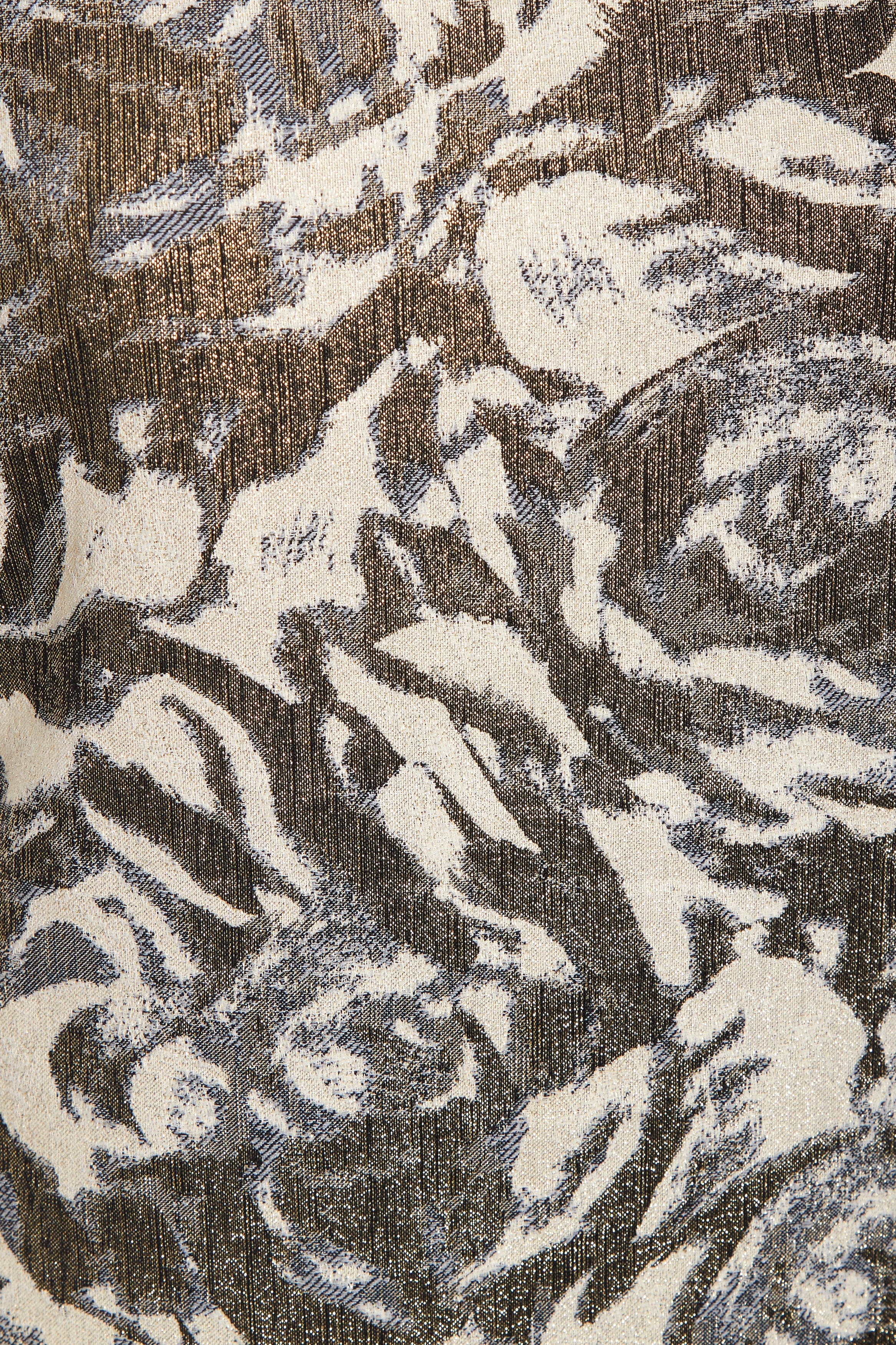 Textured fabric with abstract pattern in brown, beige, and black