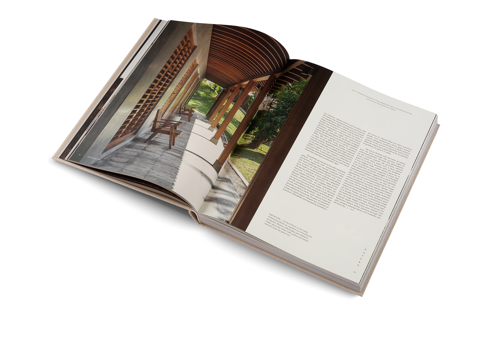 Open book showing a page with architectural design and another with text on a white background