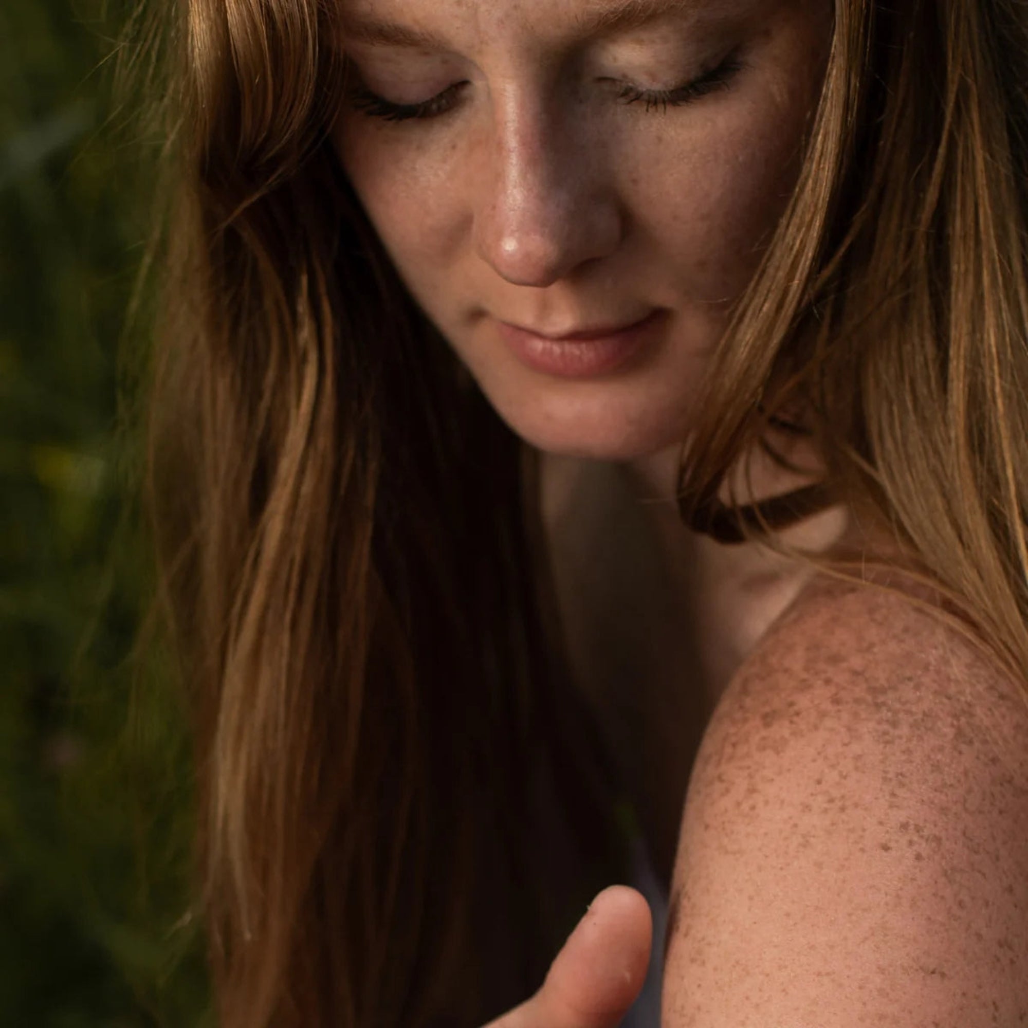 Close-up of a woman with long hair and a blurred background