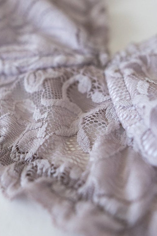 Close-up of lace fabric on a white background