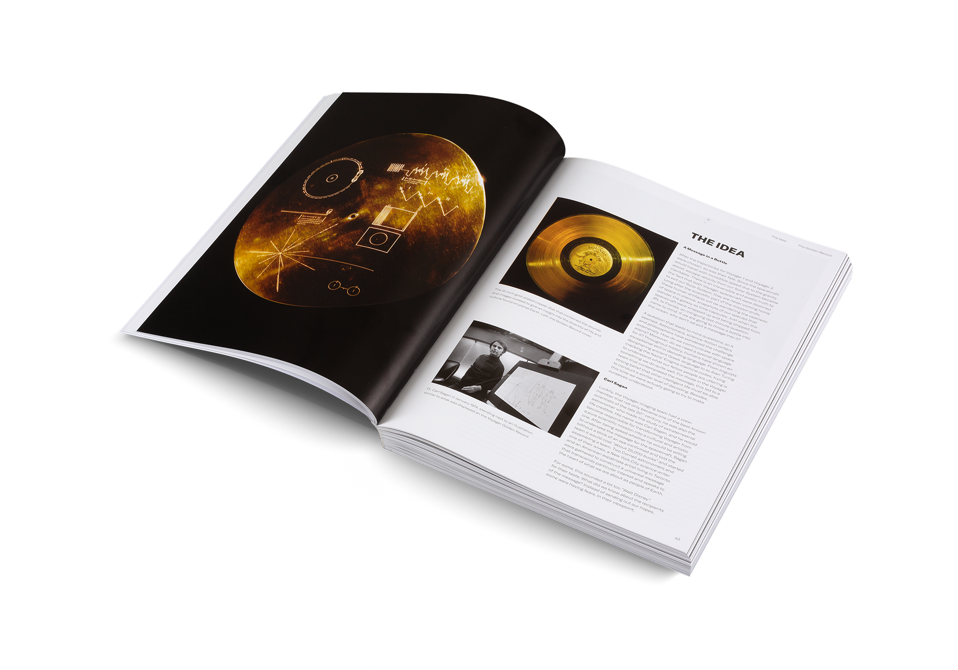 Open book with images of a gold record and a spacecraft on a white background