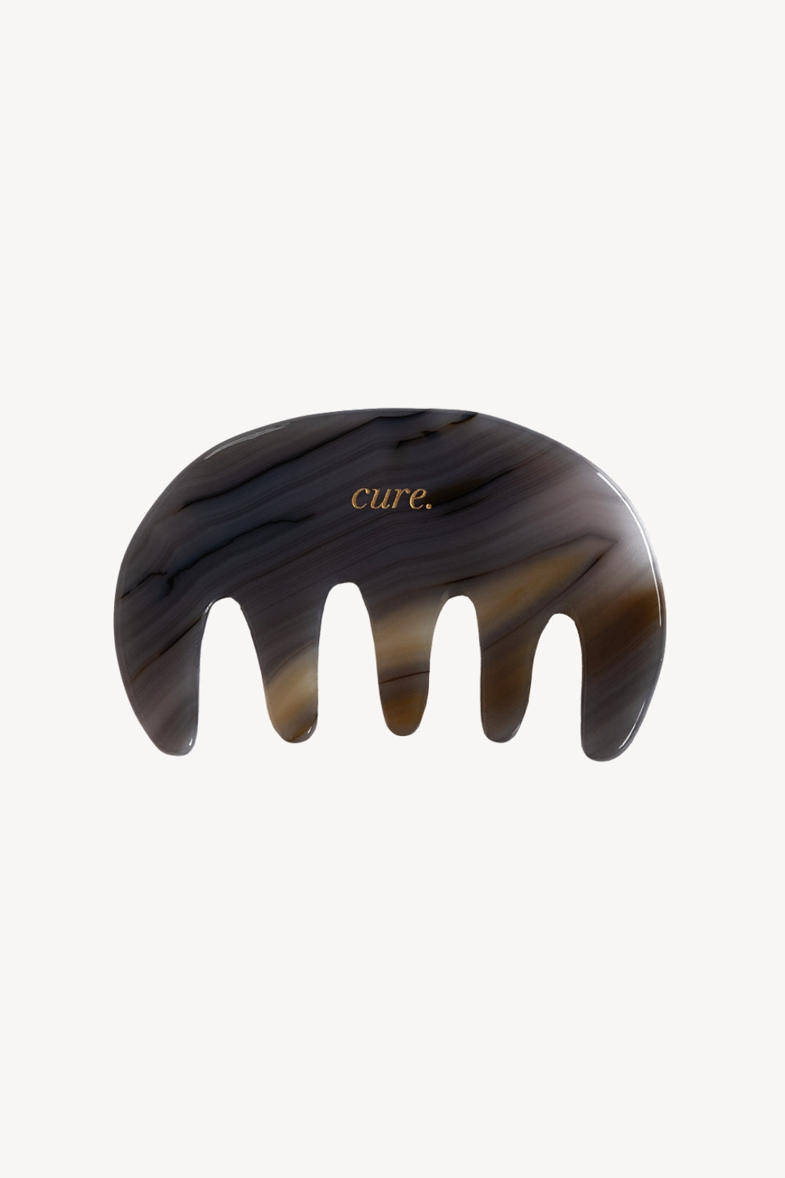A curved agate scalp comb with five large teeth, featuring a dark brown and black marbled tortoiseshell pattern and the brand name 'cure.' in gold lettering, set against a plain off-white background.