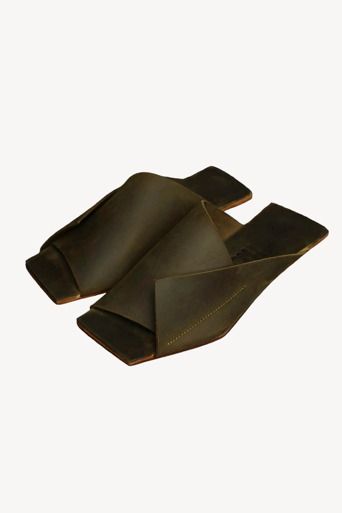 Dark olive green leather sandals on a white background