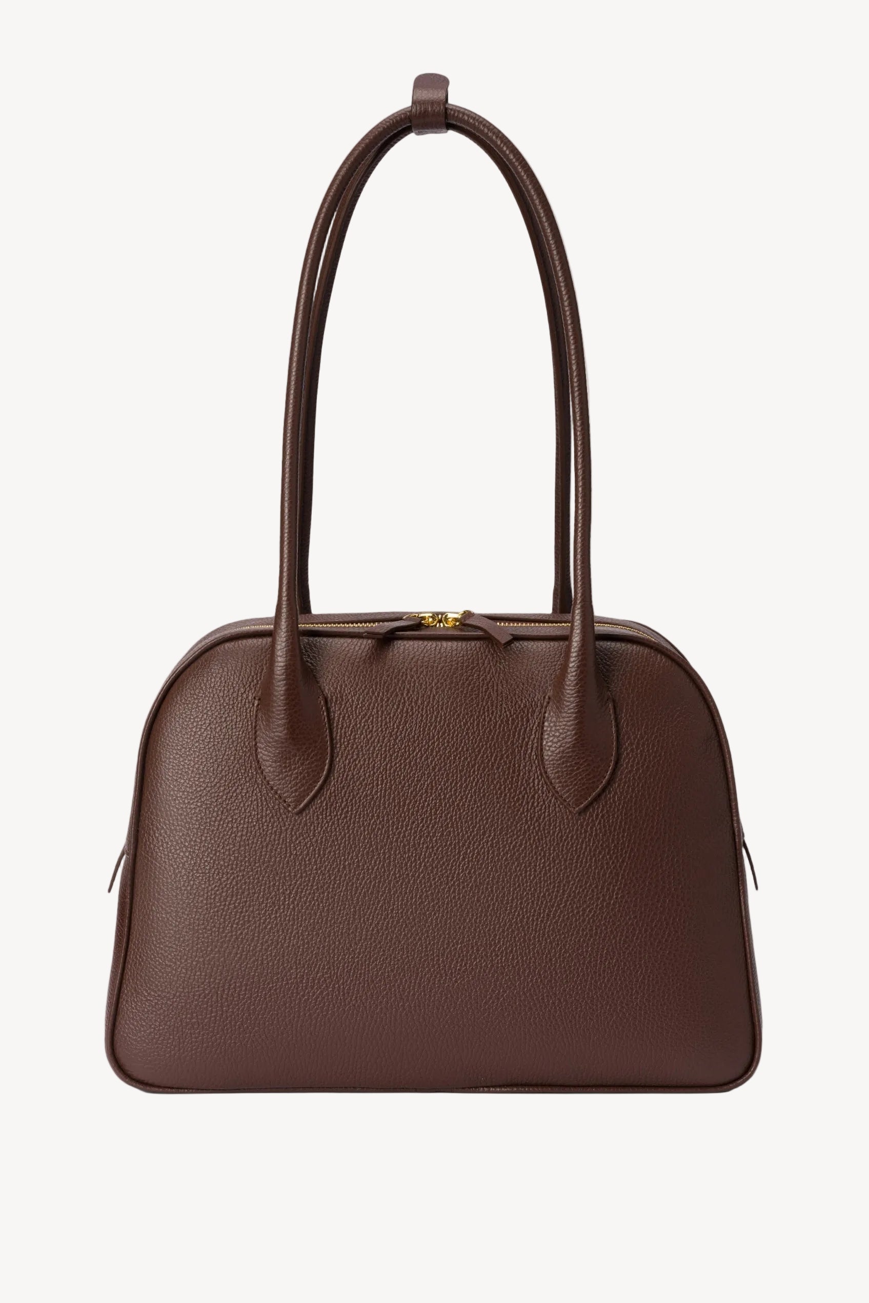 Brown handbag with a handle on a light gray background