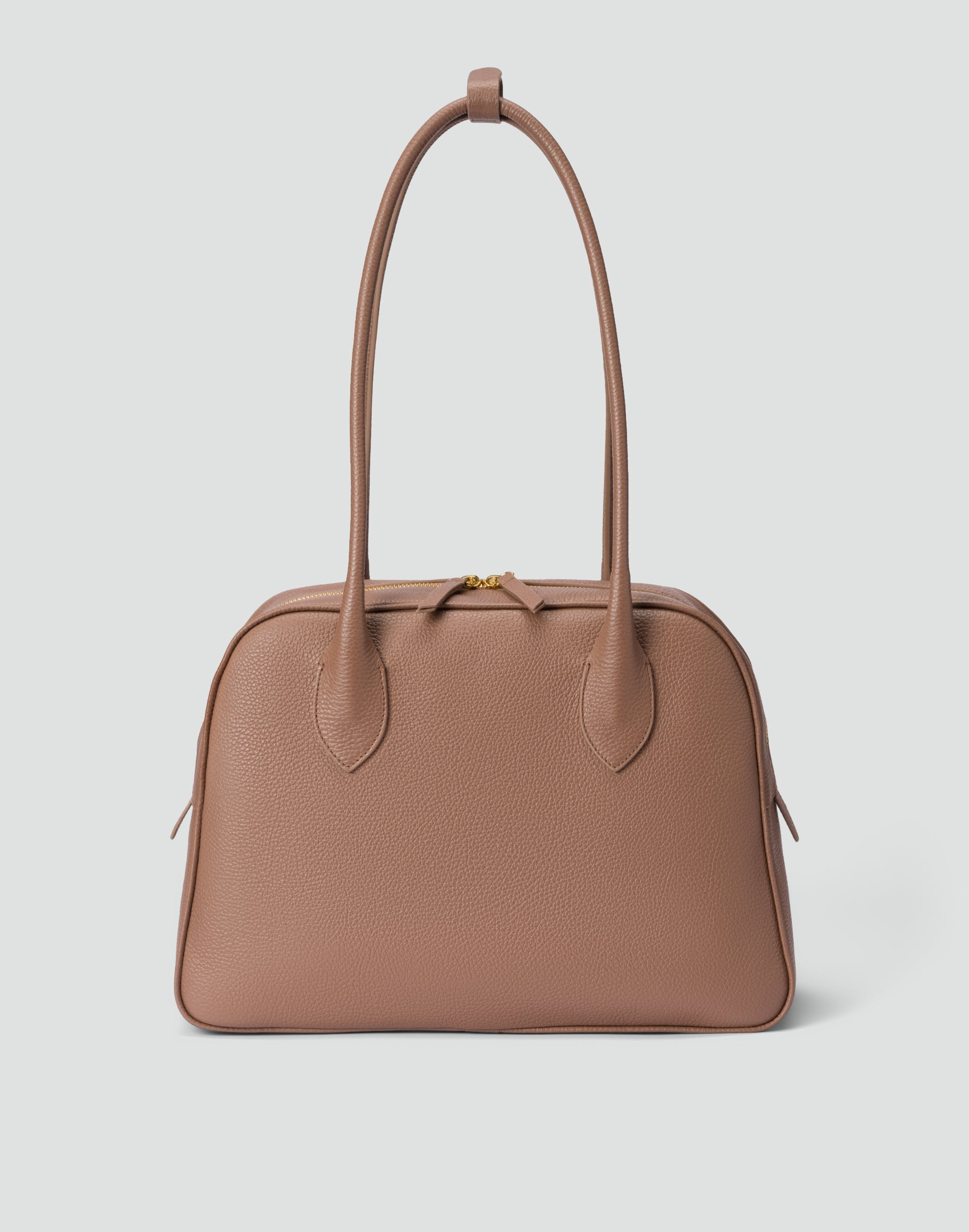 Brown handbag on a light gray background