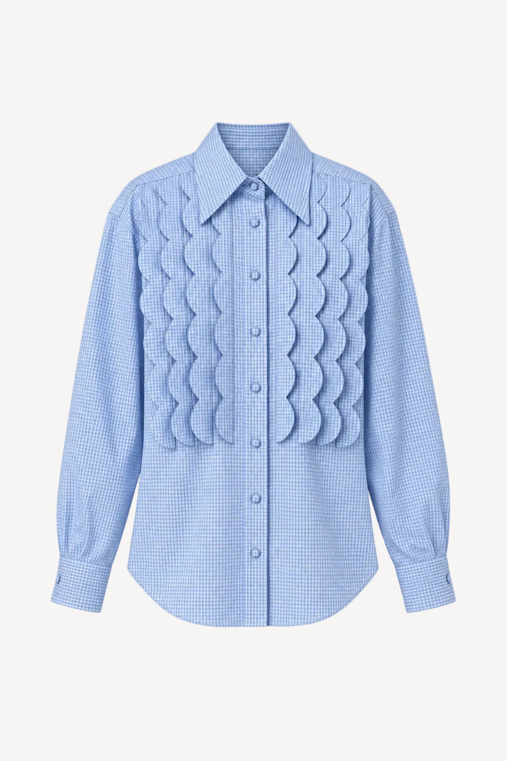 A light blue and white gingham long-sleeve button-up shirt with a unique textured, layered scalloped pleated design across the chest, displayed on a clean off-white background.