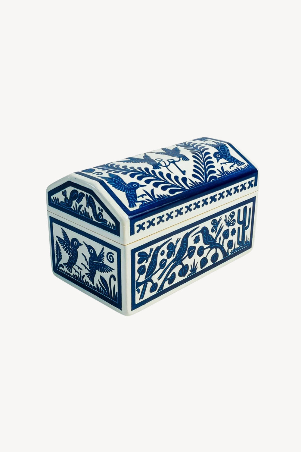 A small decorative lidded keepsake box with a cream-colored body and dark blue hand-painted floral and bird motifs, shown on a plain white background.