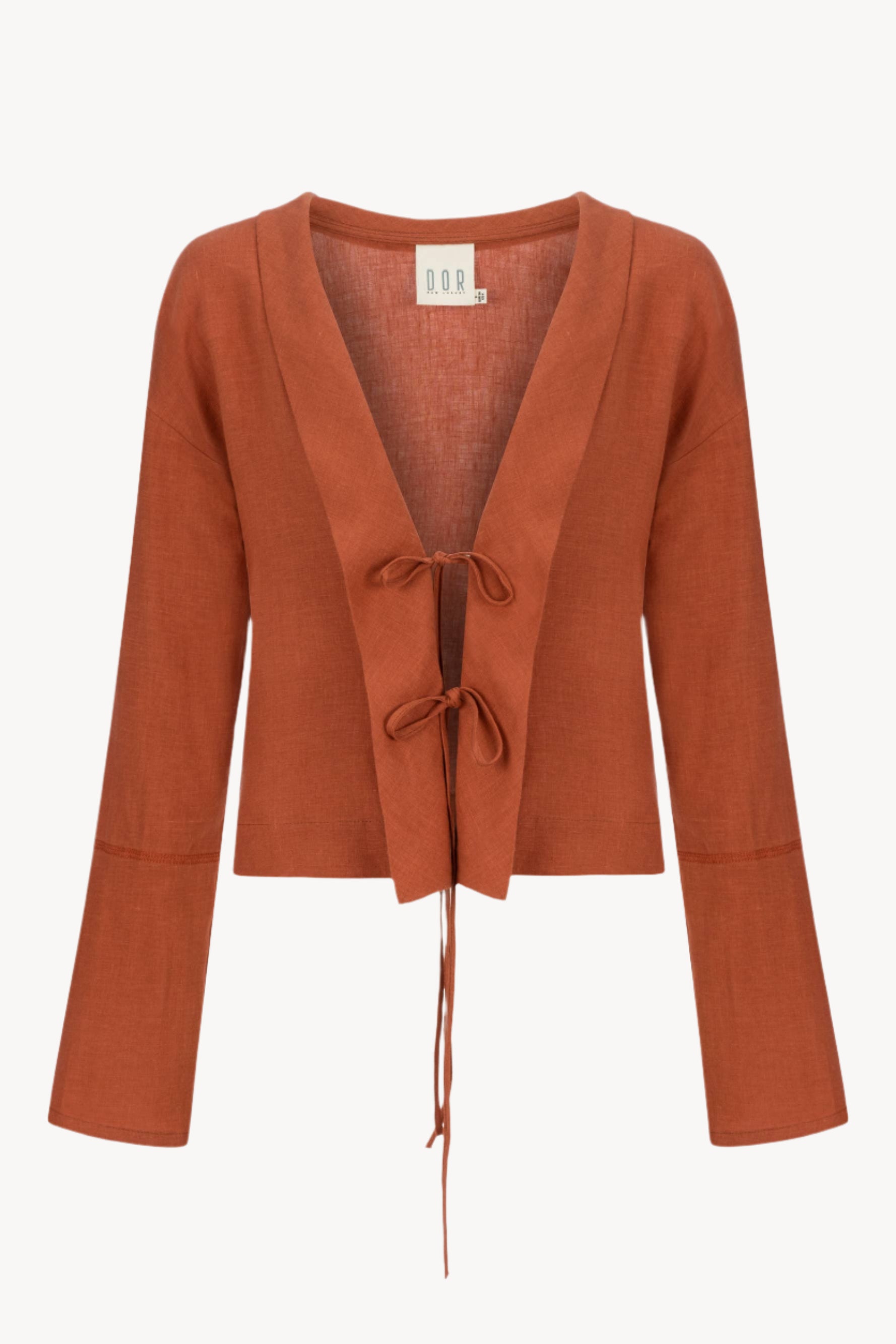Burnt Orange linen cardigan with a tie front on a white background