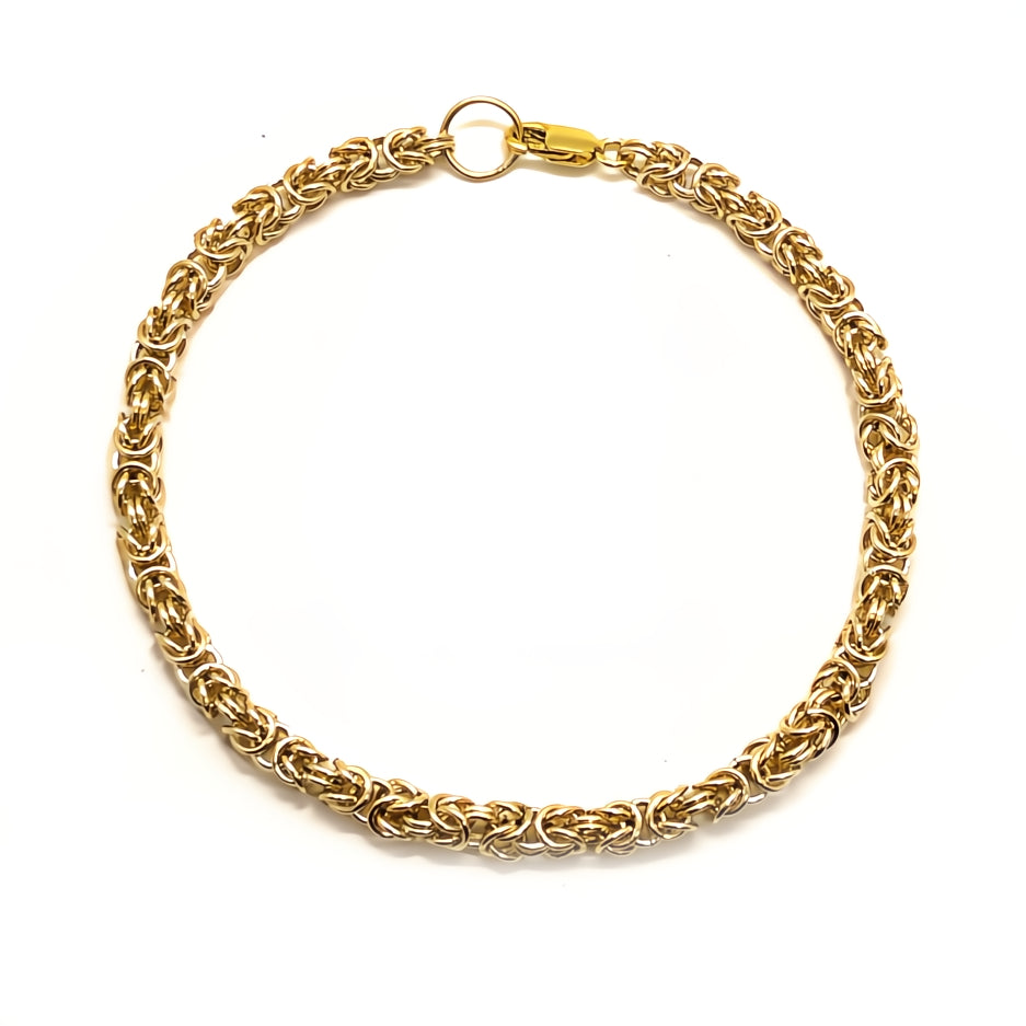 Gold chain bracelet on a white background