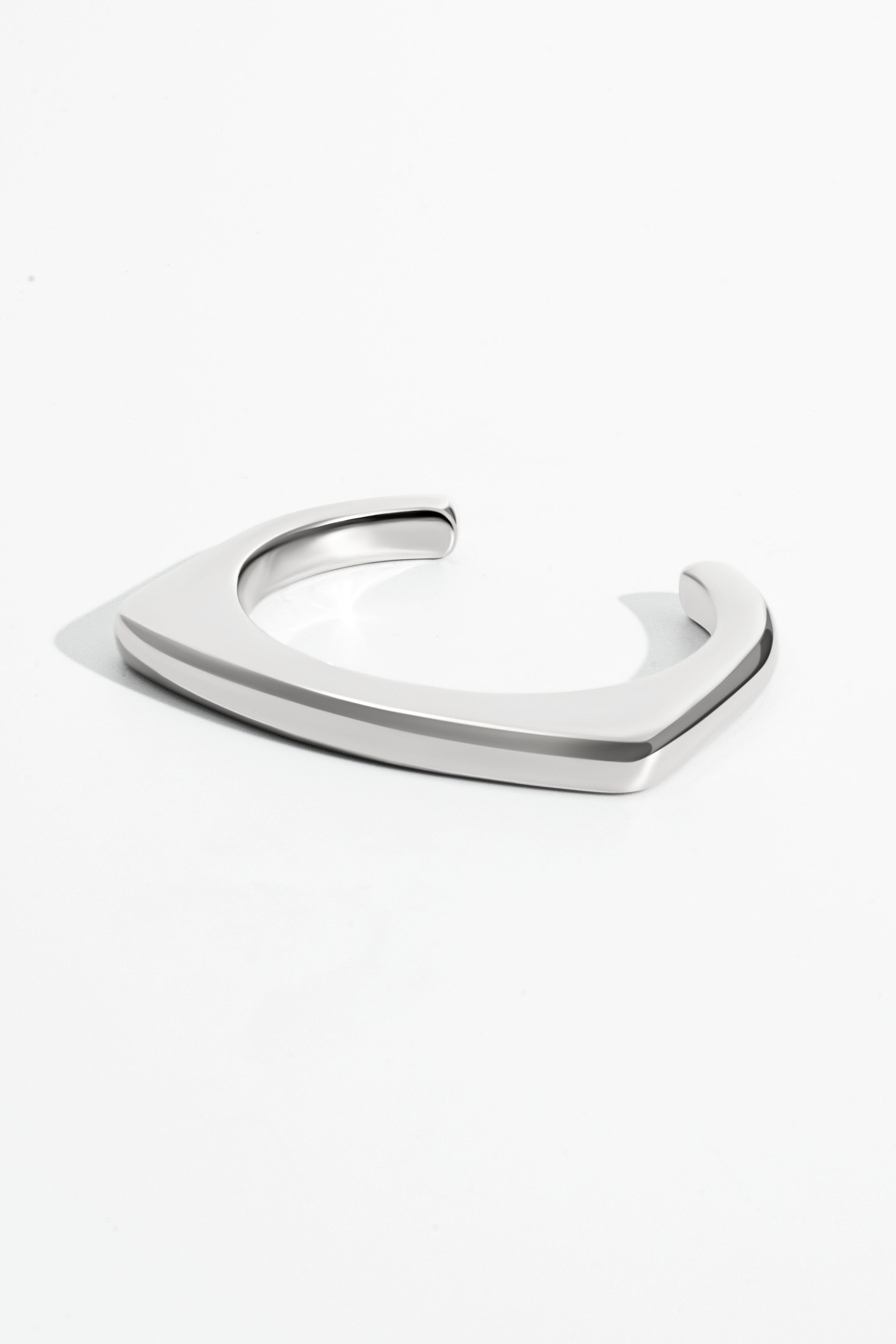 Silver geometric bracelet on a white background