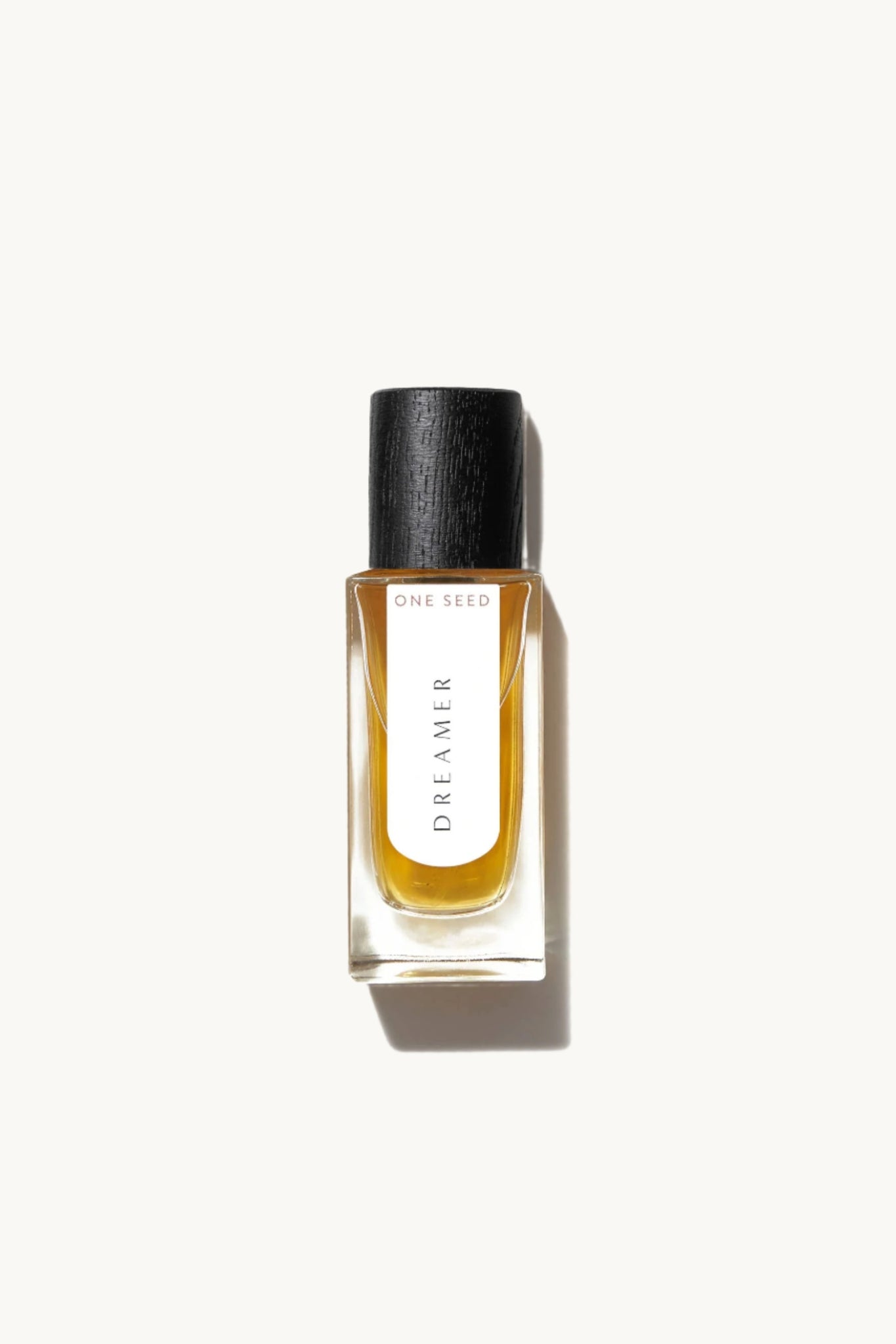 Perfume bottle from the fragrance brand 'One Seed' labeled 'Dreamer' on a white background