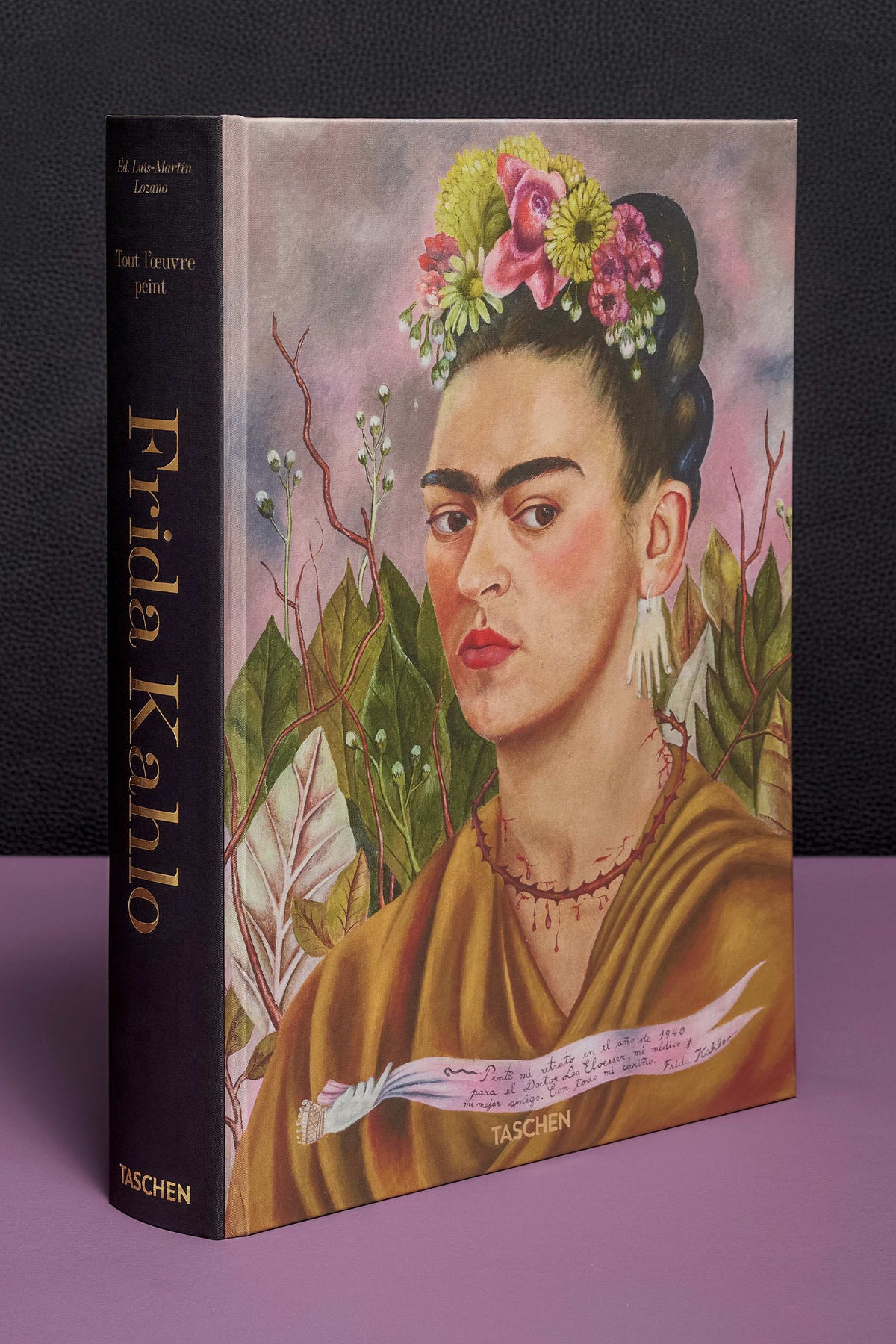 Book cover with a portrait of a famous artist on a black and purple background