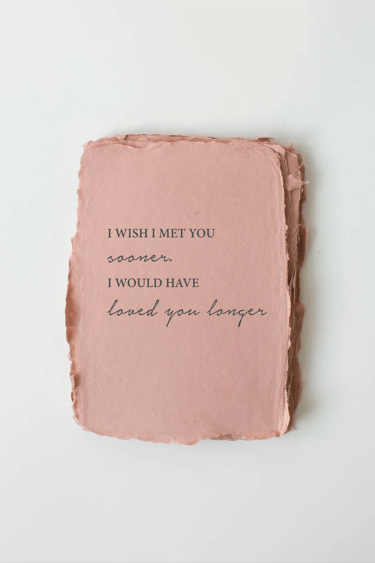 Pink textured square with a romantic quote on a white background