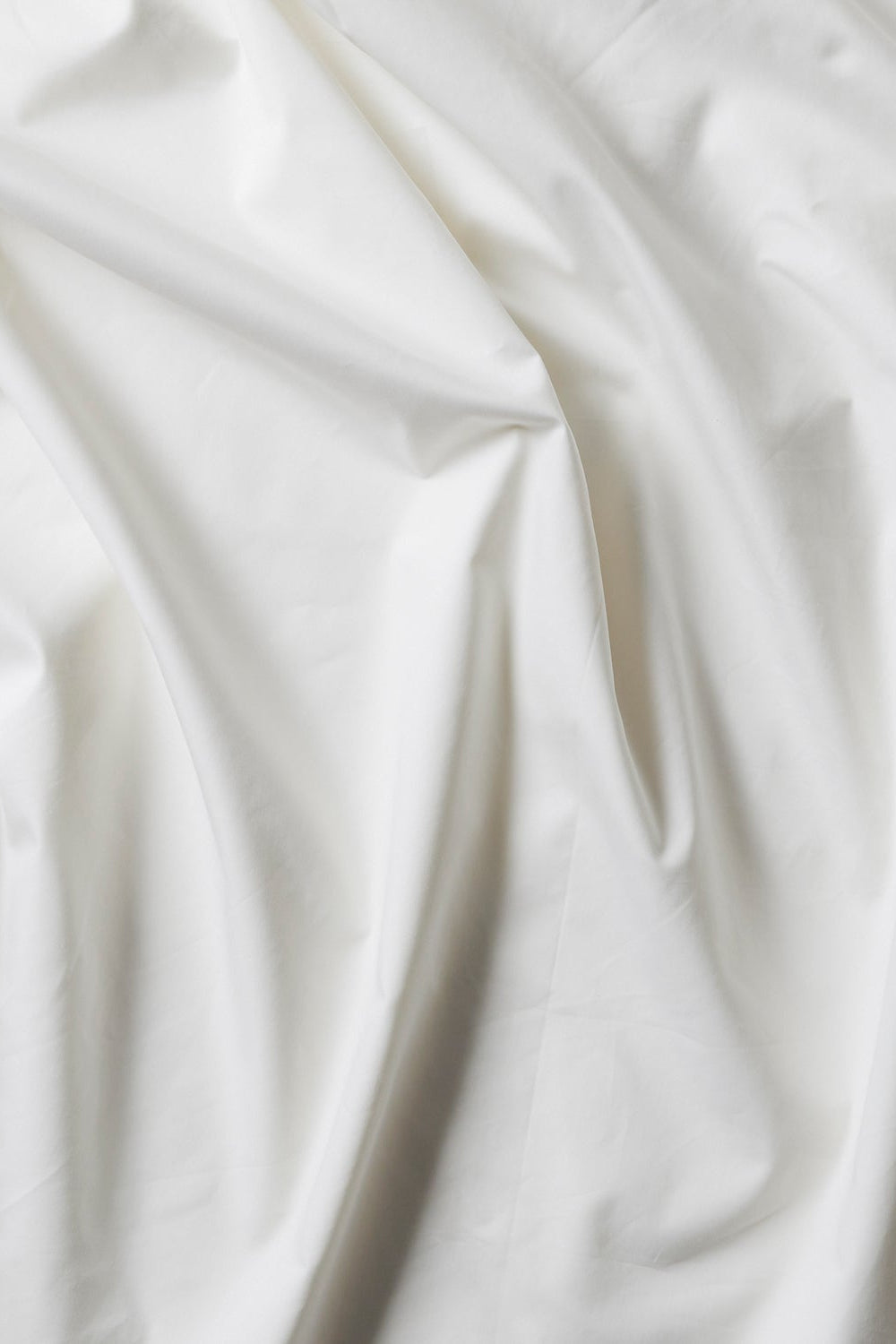 Close-up of white fabric with folds