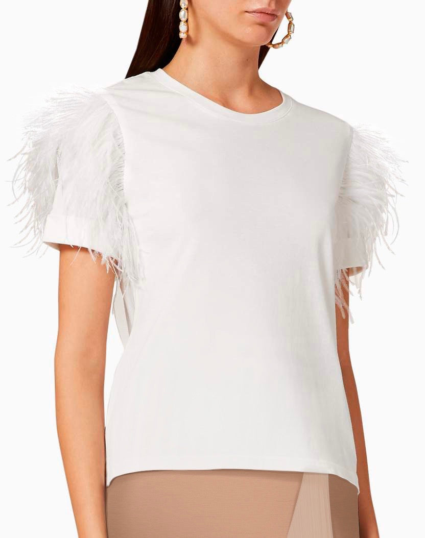 White blouse with feathered shoulders worn by a model on a white background