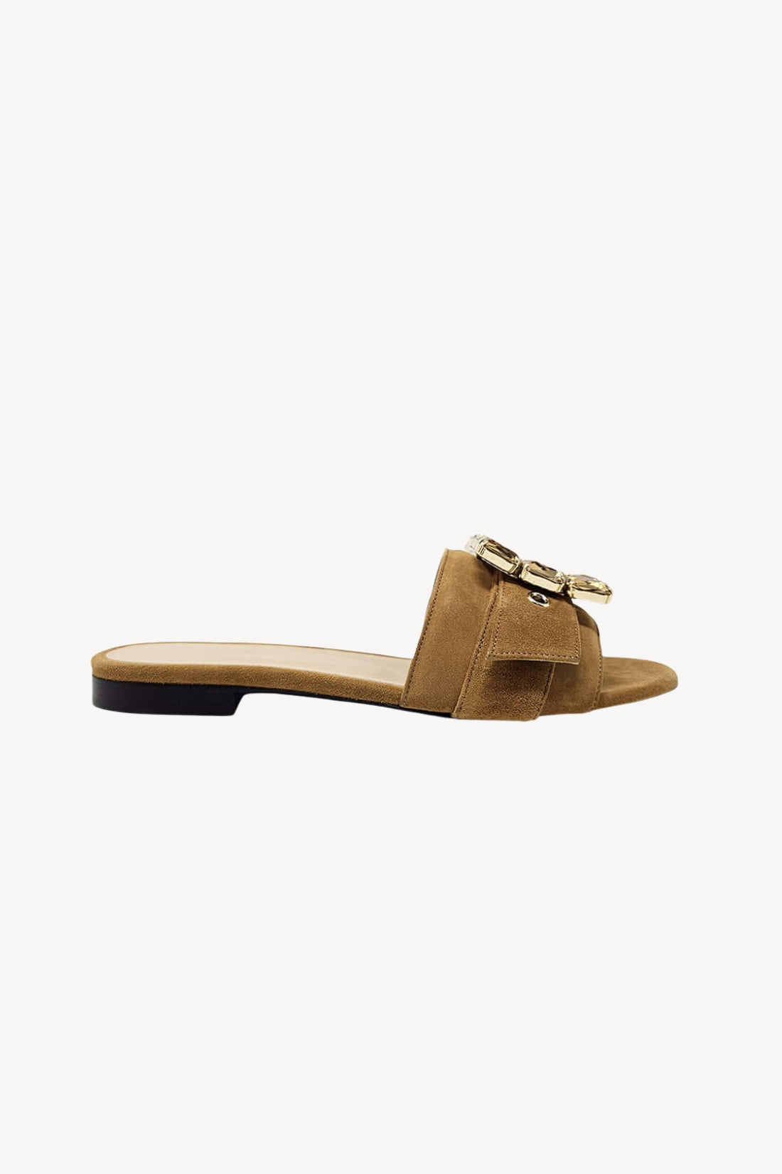 Tan suede sandal with a gold jewels on a white background