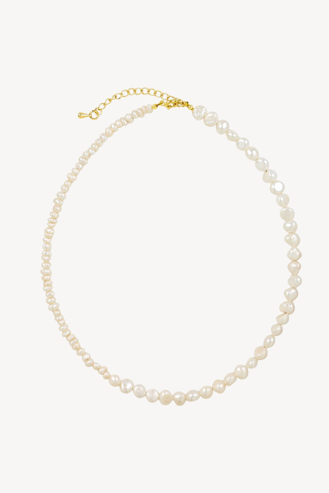 Pearl necklace with gold clasp on a white background