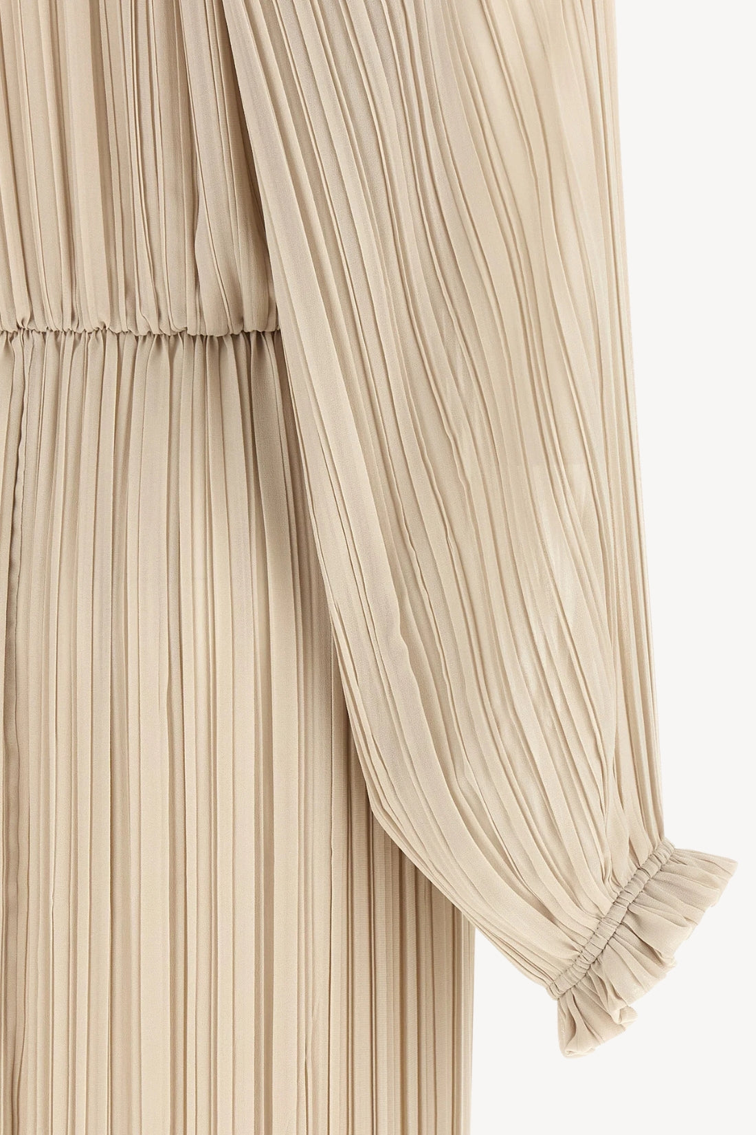 Close-up of a pleated beige garment with a gathered sleeve and elasticized cuff, shown against a plain light background.