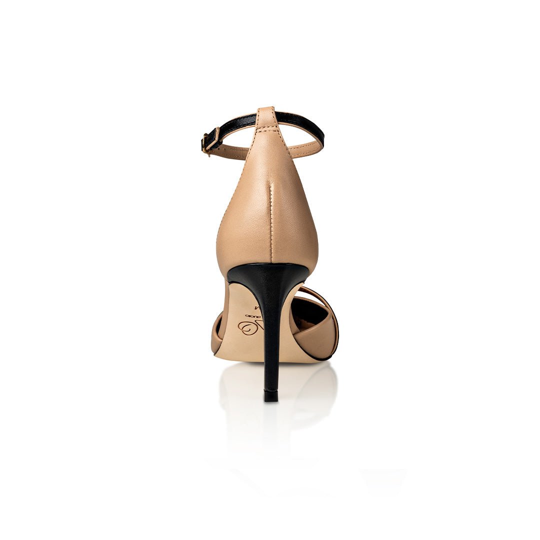 Beige high-heeled shoe with black heel on a white background
