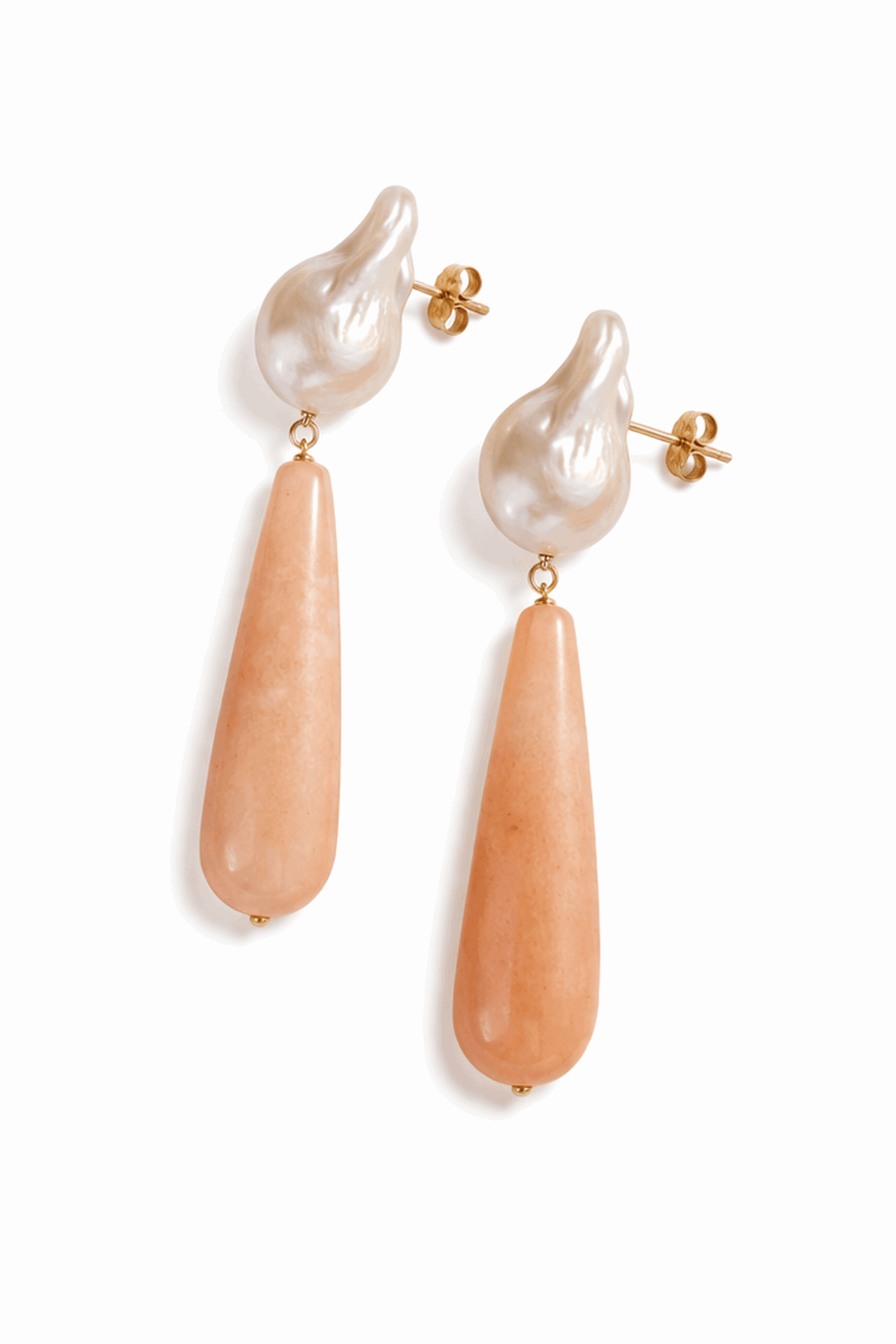 Pair of earrings with pearl and peach-colored stone drops on a white background