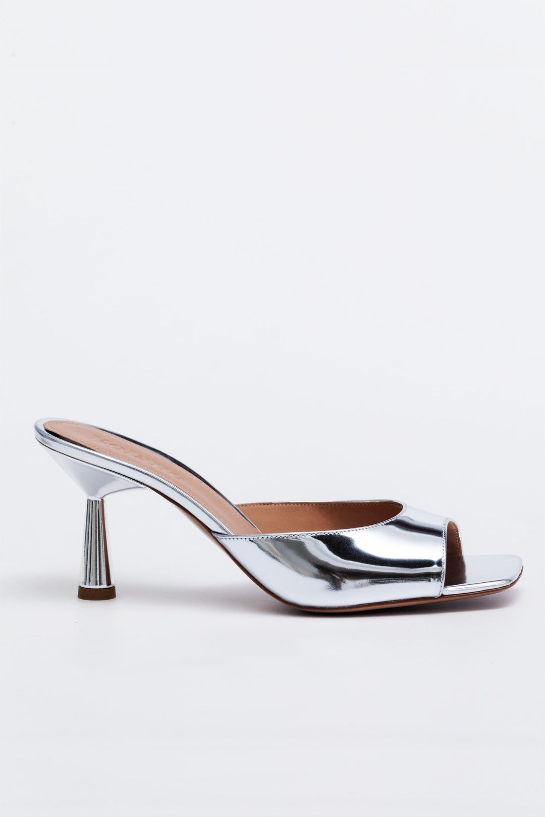 Silver high-heeled shoe on a white background