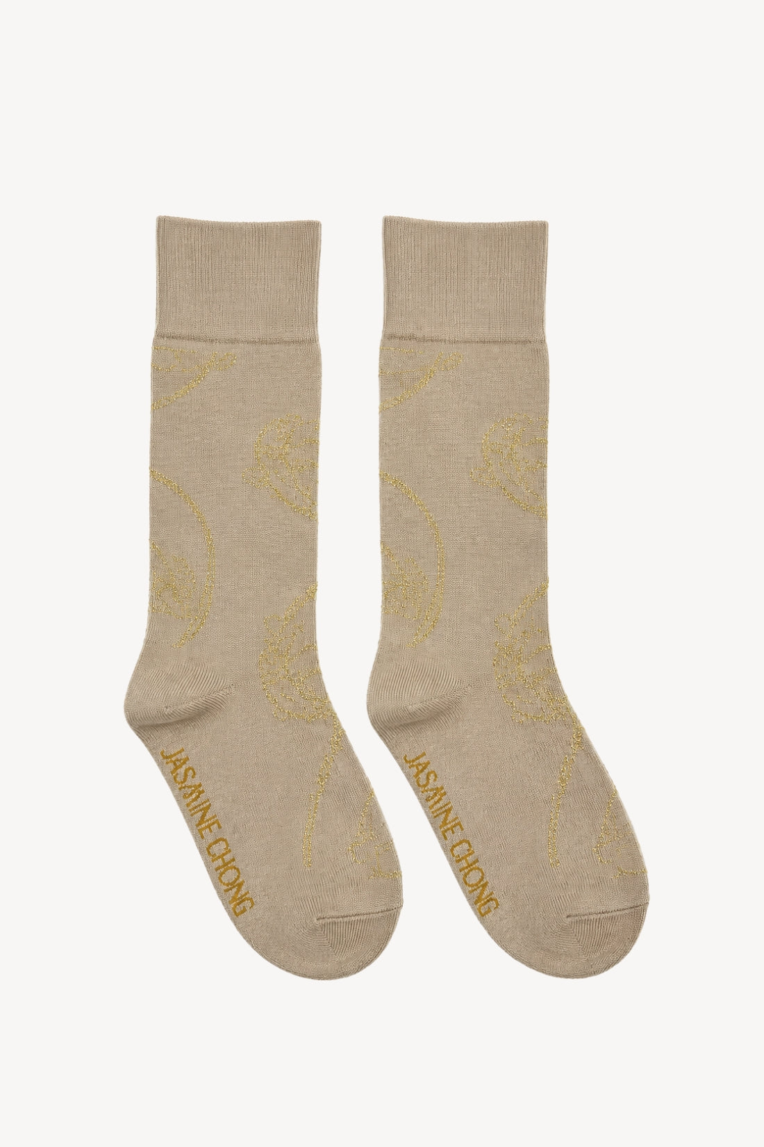 Pair of beige socks with gold accents on a white background
